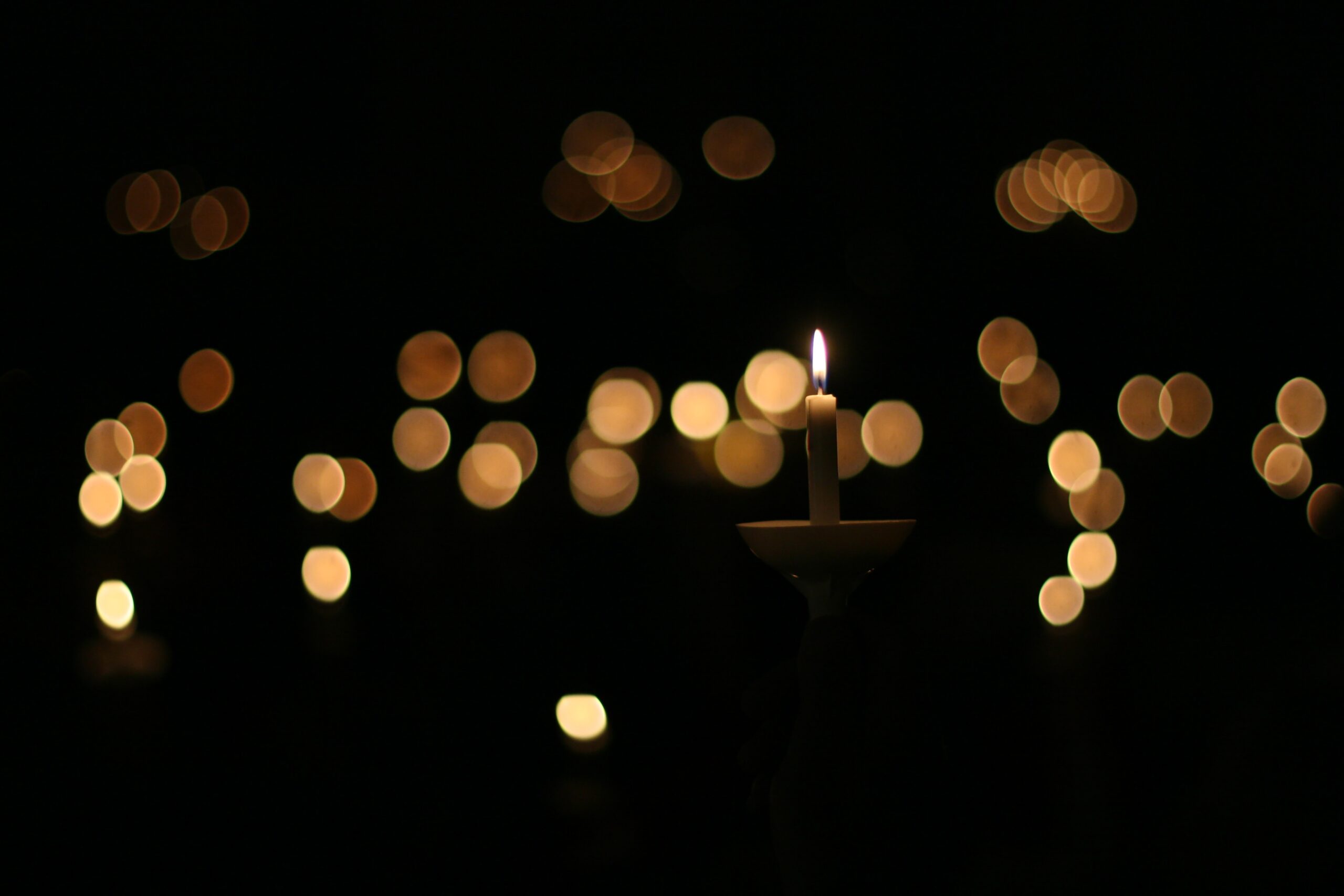 Candle lit in the dark