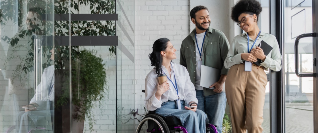 People standing in a workplace setting.