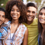 Four people youth aged smiling