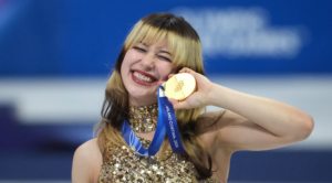 Alysa Liu, US figure skater, holding her gold medal