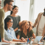 Group of people in an office looking together at the same direction