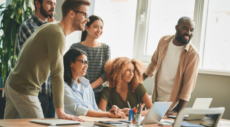 Group of people in an office looking together at the same direction