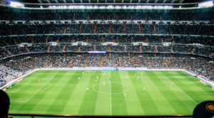 Packed football stadium hosting an international soccer match, representing global connection, diversity, and belonging at the FIFA World Cup.