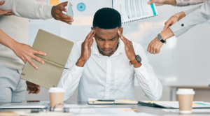 Employee experiencing workplace burnout and stress caused by an always-on work culture and competing demands