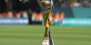 FIFA Women's World Cup trophy displayed on the field, representing the future of women's football and global competition.