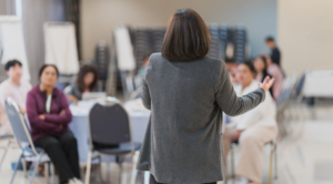Facilitator leading a corporate diversity training session with employees during an interactive workplace learning workshop.