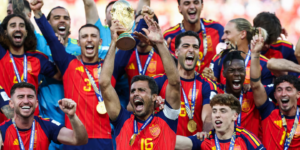 Spain's players celebrate after winning the 2026 FIFA World Cup, lifting the championship trophy together.
