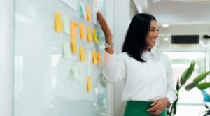 Professional Woman Presenting Goals and Strategies During a Planning Session