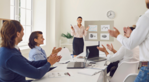Employee presenting ideas to colleagues, illustrating collaboration, leadership and the human skills shaping the future of work
