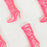 Pattern of pink cowboy boots inspired by Dolly Parton and the 9 to 5 era