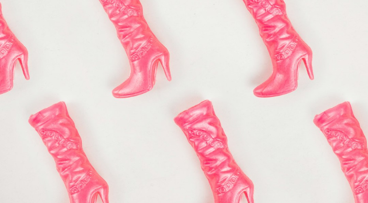 Pattern of pink cowboy boots inspired by Dolly Parton and the 9 to 5 era