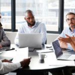 Diverse team discussing workplace culture, harassment prevention and employee safety during a meeting