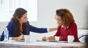 Manager listening to an employee during a private and supportive workplace conversation