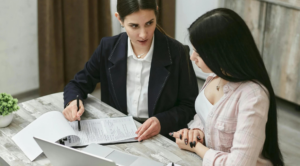 Workplace professional reviewing documents and notes as part of a structured workplace investigation process.